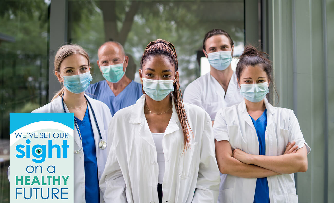 Doctors in medical masks standing together